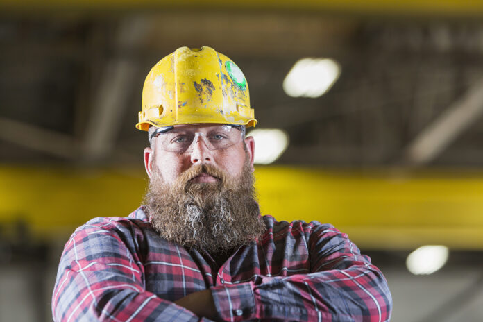 Bearded construction worker wearing hardhat